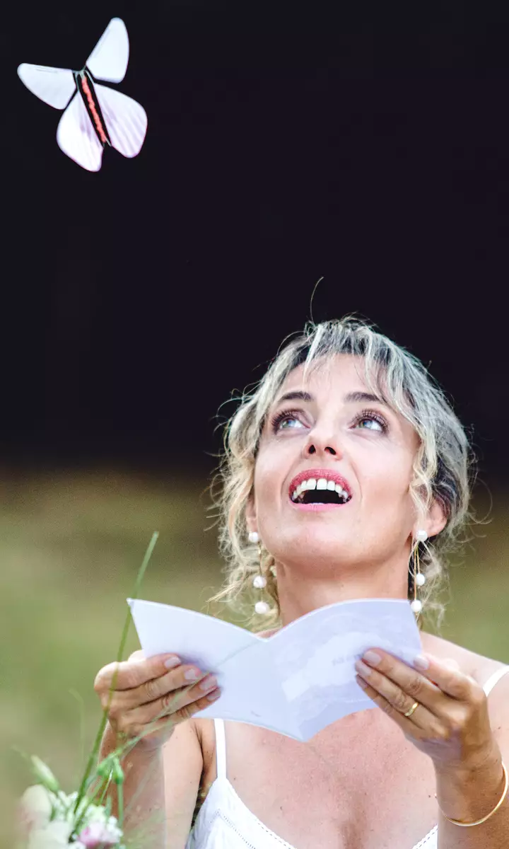 Magicflyer, a woman receives a magic butterfly